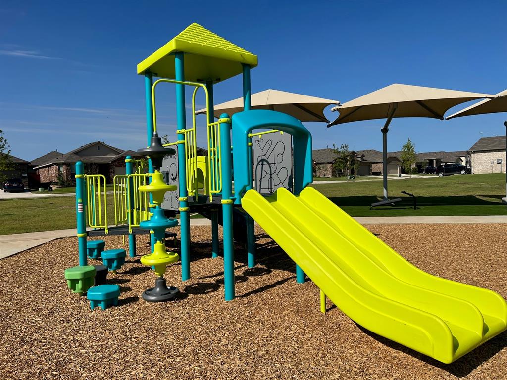 15540 Balham Path Fort Worth, TX 76247 - Photo 35 of 40 a view of a park with a slide and potted plants