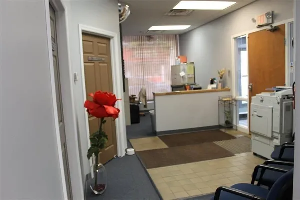 a kitchen with a sink appliances and cabinets
