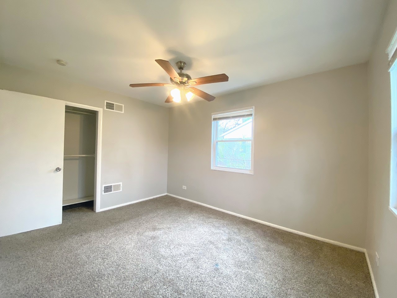23922 South Cretewood Lane Crete, IL 60417 - Photo 7 of 18 a view of an empty room with a window