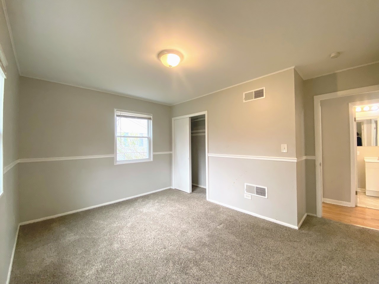 23922 South Cretewood Lane Crete, IL 60417 - Photo 10 of 18 an empty room with windows