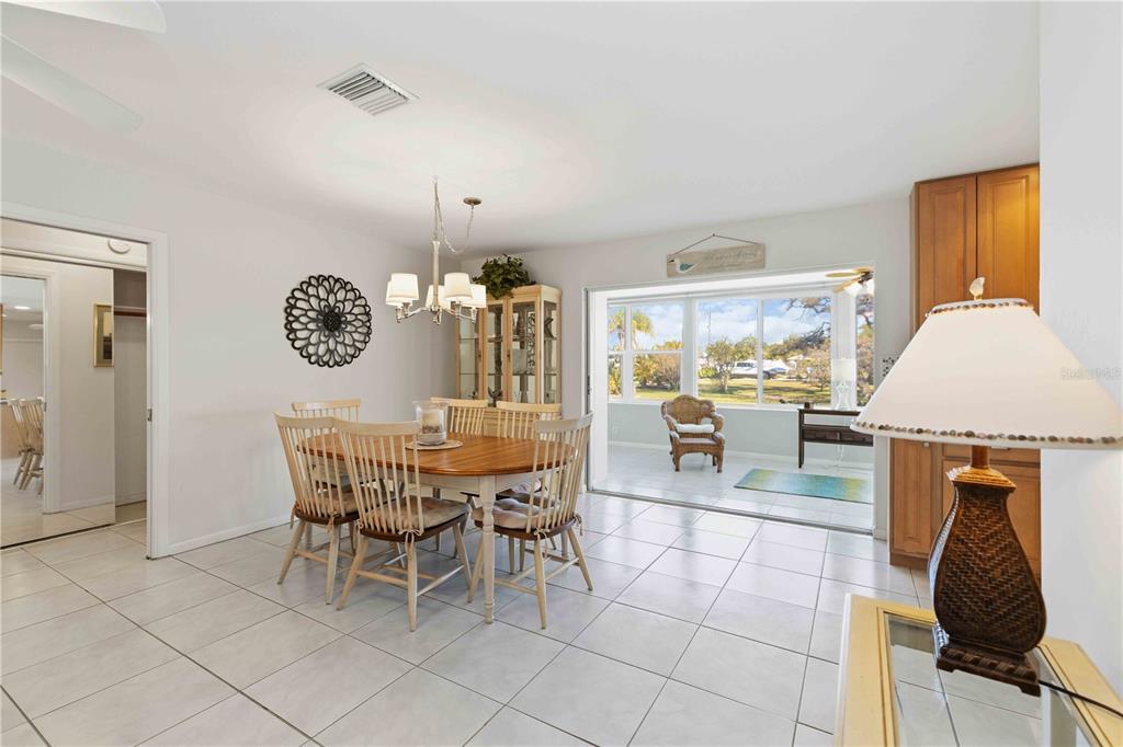 840 Channel Acres Road Nokomis, FL 34275 - Photo 12 of 48 a view of a dining room with furniture