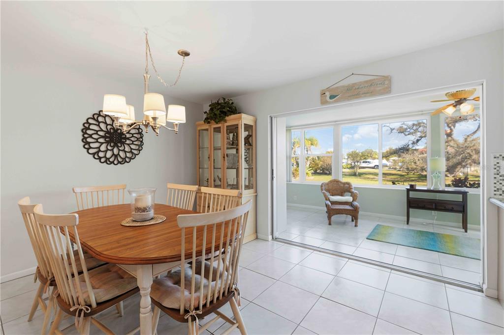 840 Channel Acres Road Nokomis, FL 34275 - Photo 13 of 48 a view of a dining room with furniture window and outside view