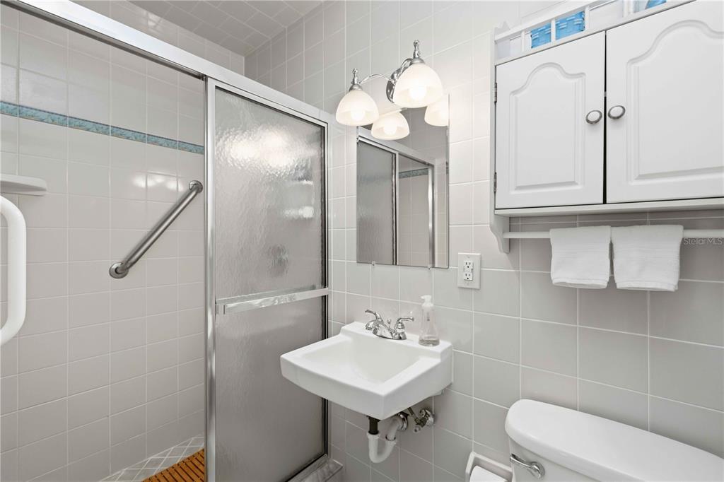 840 Channel Acres Road Nokomis, FL 34275 - Photo 27 of 48 a bathroom with a sink a toilet and a mirror