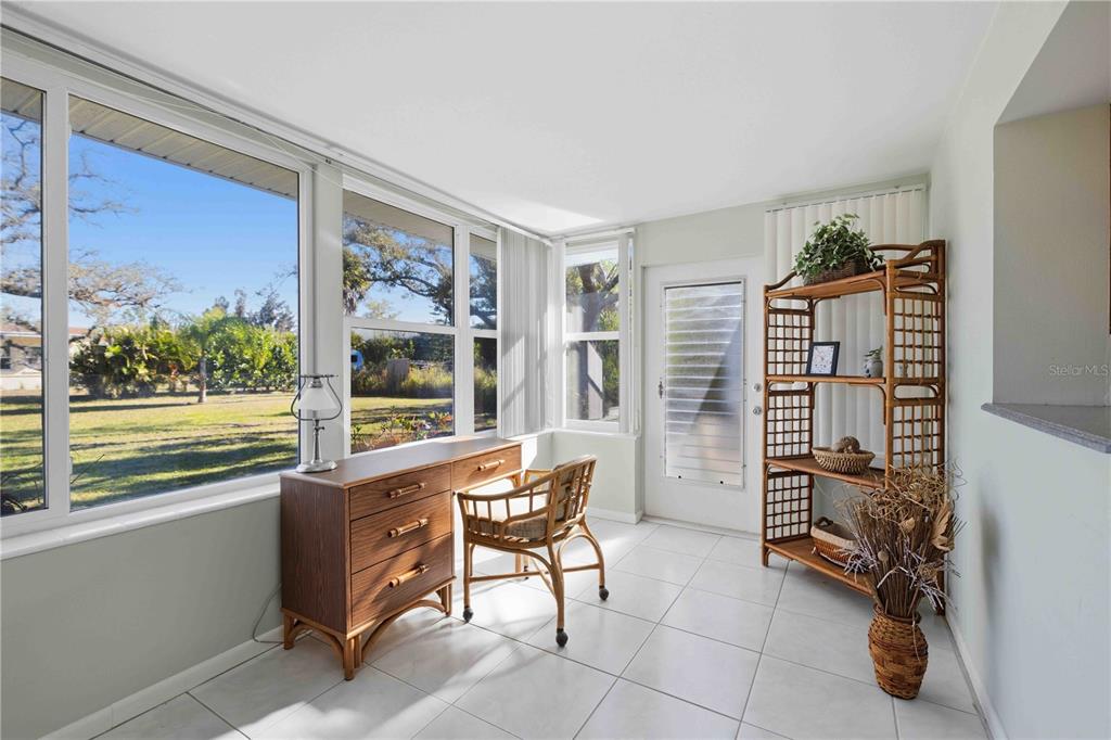 840 Channel Acres Road Nokomis, FL 34275 - Photo 29 of 48 a living room with furniture and a window