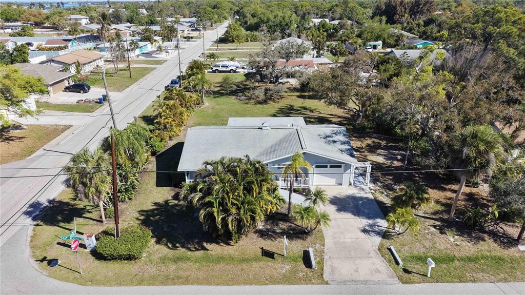 840 Channel Acres Road Nokomis, FL 34275 - Photo 38 of 48 an aerial view of a house with a yard and lake view