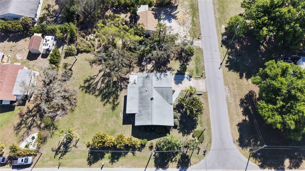 840 Channel Acres Road Nokomis, FL 34275 - Photo 47 of 48 an aerial view of a house with a yard and garden