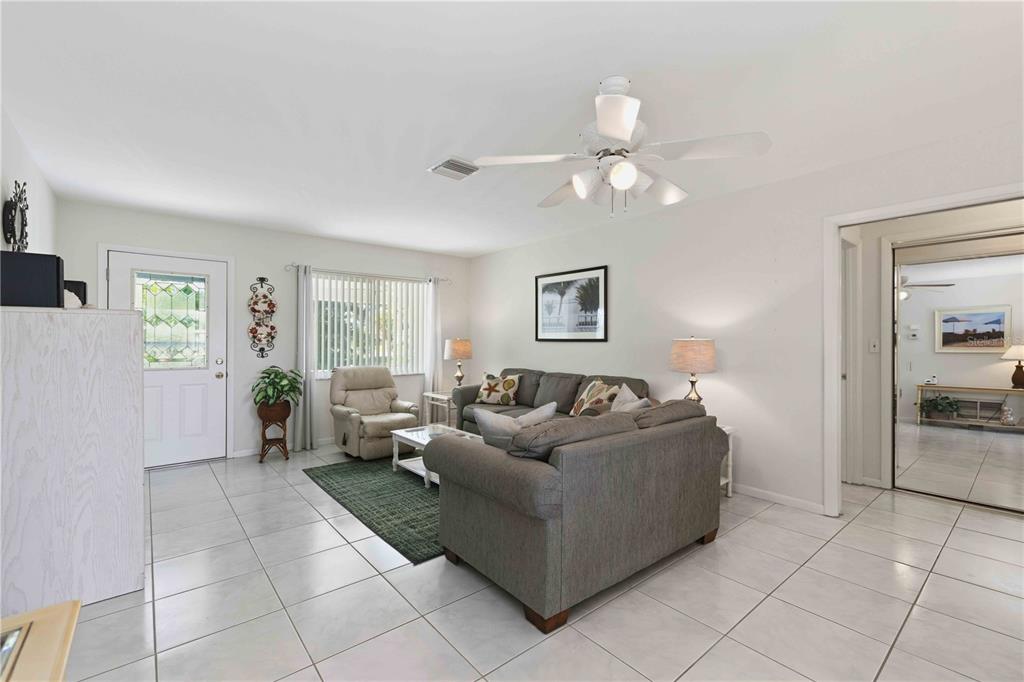 840 Channel Acres Road Nokomis, FL 34275 - Photo 9 of 48 a living room with furniture and a window