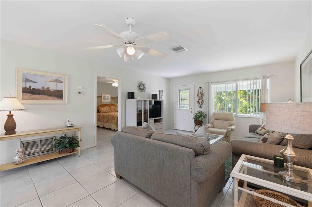 840 Channel Acres Road Nokomis, FL 34275 - Photo 10 of 48 a living room with furniture and wooden floor