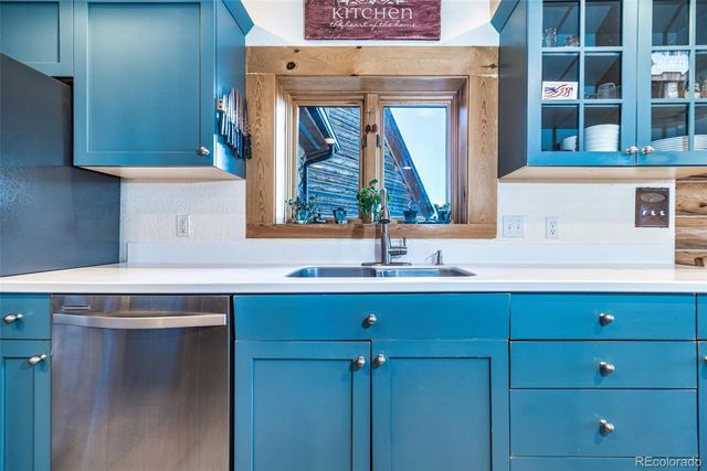 a bathroom with a sink a mirror and a window