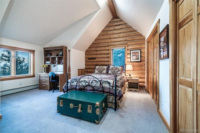 a bedroom with furniture and a window