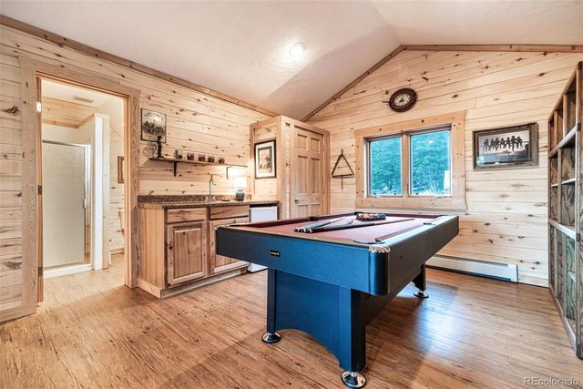 a kitchen with a stove and a refrigerator