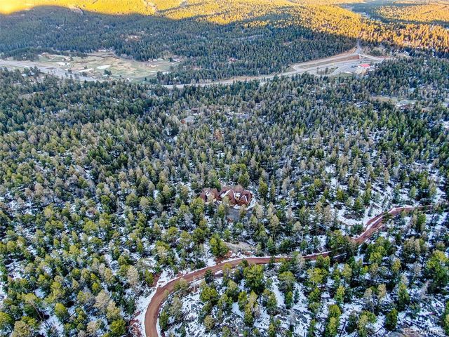 an aerial view of residential house and green space