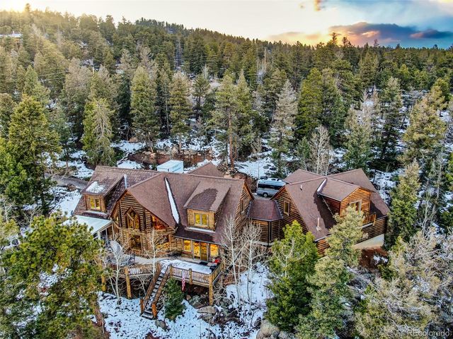 an aerial view of a house with a garden