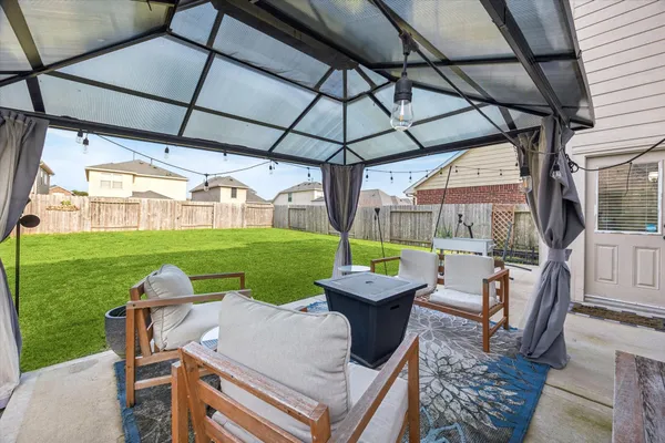 a view of yard with patio
