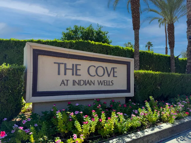 a view of multiple houses with a street