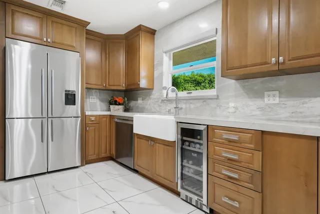 a view of a patio with table and chairs and potted plants