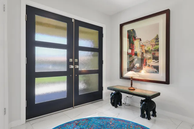 a kitchen with a sink cabinets and stainless steel appliances