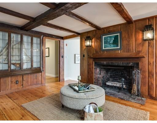 50 Mussell Point Road Gloucester, MA 01930 - Photo 13 of 30 a living room with furniture and a fireplace
