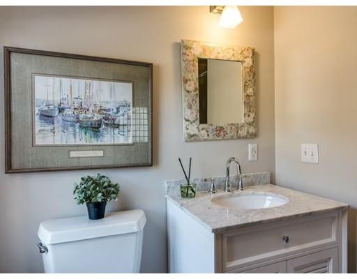 50 Mussell Point Road Gloucester, MA 01930 - Photo 14 of 30 a bathroom with a granite countertop sink a toilet and mirror