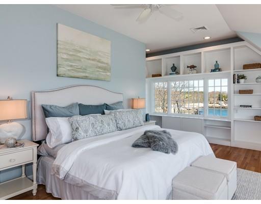 50 Mussell Point Road Gloucester, MA 01930 - Photo 18 of 30 a large white bed sitting in a bedroom next to a window
