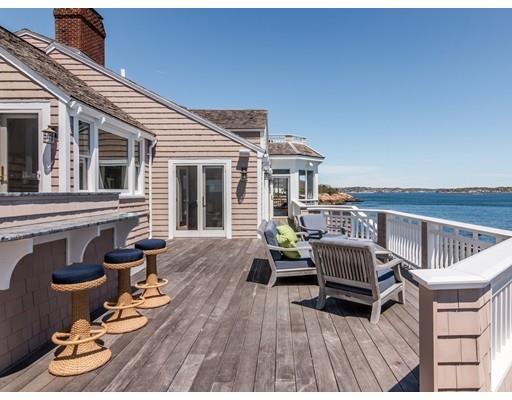 50 Mussell Point Road Gloucester, MA 01930 - Photo 24 of 30 a balcony with wooden furniture and outdoor seating