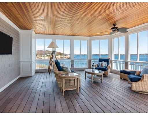 50 Mussell Point Road Gloucester, MA 01930 - Photo 5 of 30 a living room with furniture a large window and wooden floor