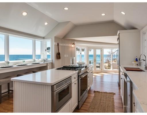 50 Mussell Point Road Gloucester, MA 01930 - Photo 9 of 30 a kitchen with a stove a sink a refrigerator and a center island