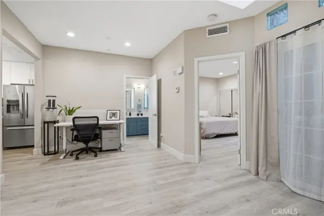 a view of a room with a flat screen tv and outdoor space