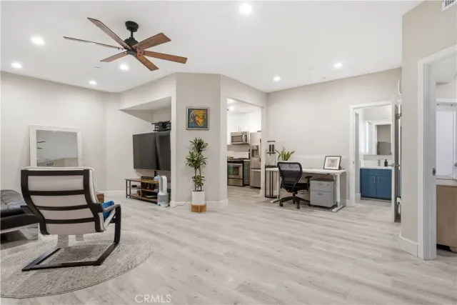 a view of a livingroom with furniture and a flat screen tv