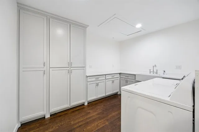 a view of storage and utility room with wooden floor