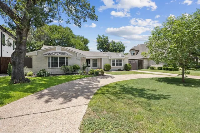 a house with swimming pool in front of it