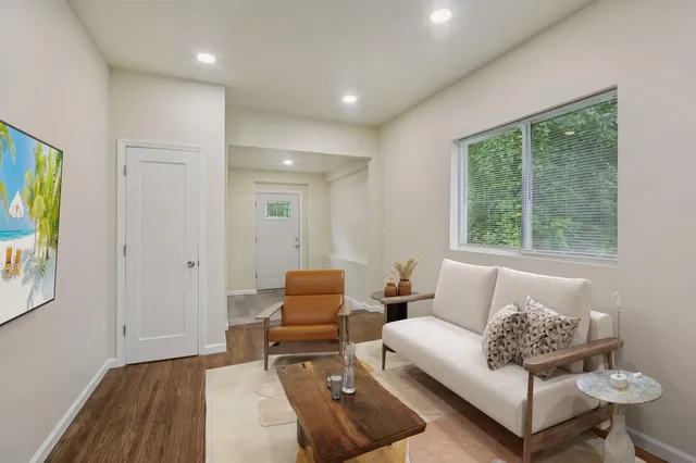 a living room with furniture and a window