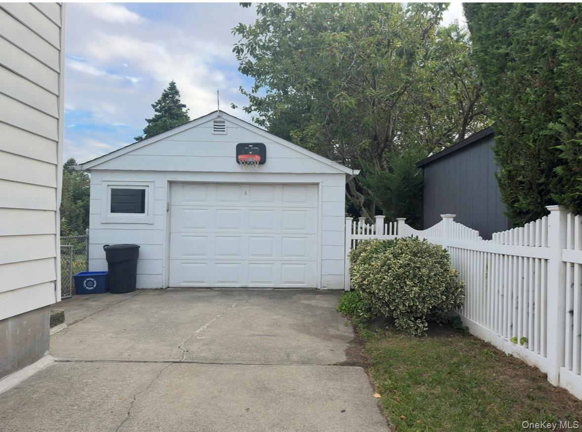 484 Chelsea Road Oceanside, NY 11572 - Photo 22 of 23 Detached garage featuring concrete driveway