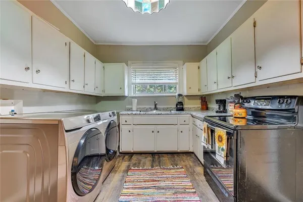 a kitchen with a sink and cabinets