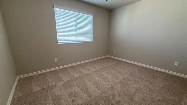 an empty room with closet area