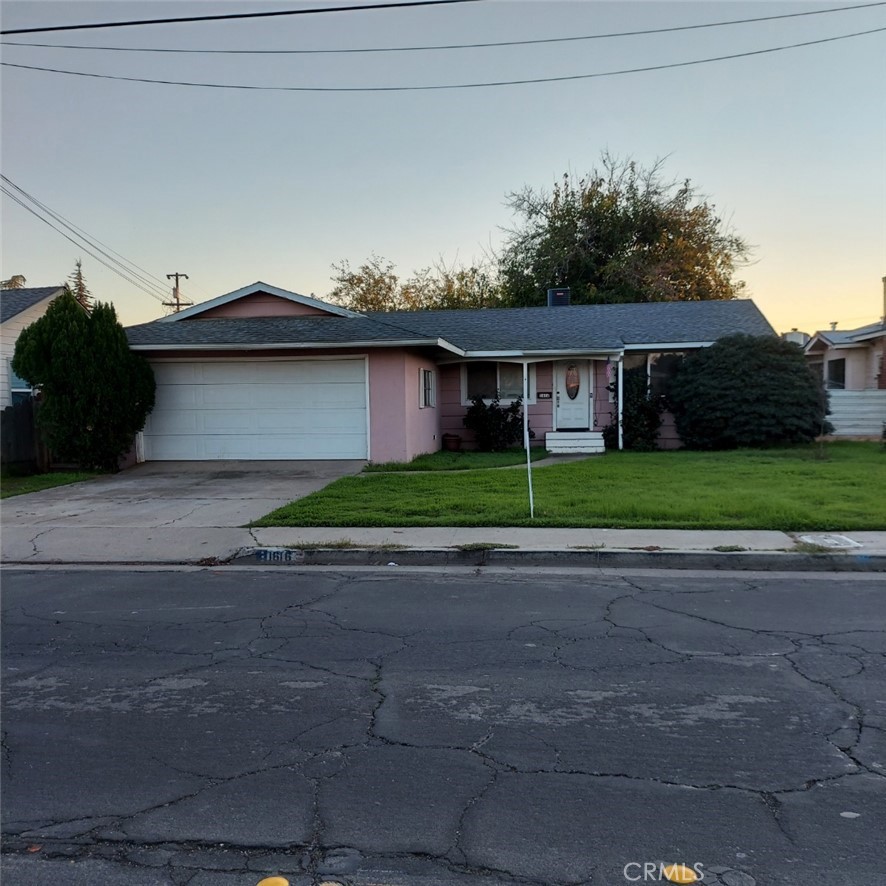 1616 East 21st Street Merced, CA 95340 - Photo 1 of 22 a front view of house with yard and green space