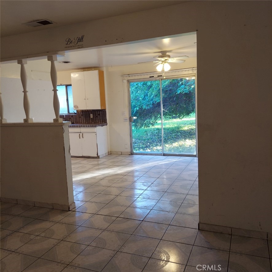 1616 East 21st Street Merced, CA 95340 - Photo 9 of 22 a view of a room with furniture and a large window