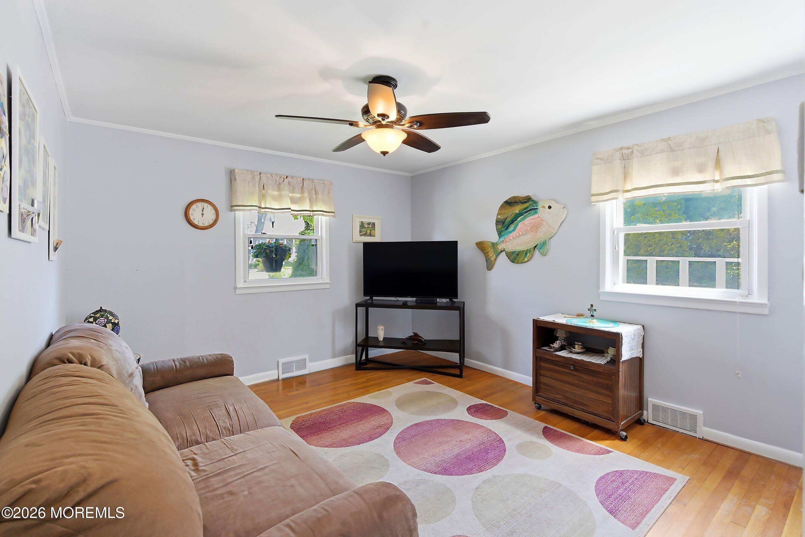 412 Moore Road Neptune Township, NJ 07753 - Photo 15 of 36 a living room with furniture and a flat screen tv