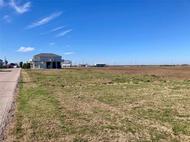 a view of a lake with a yard
