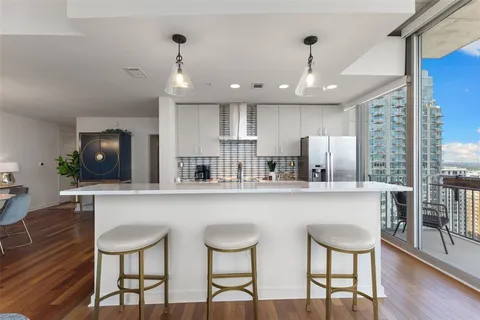 a bedroom with a bed and large window