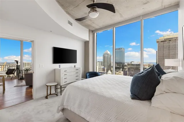 a white bath tub sitting next to a shower