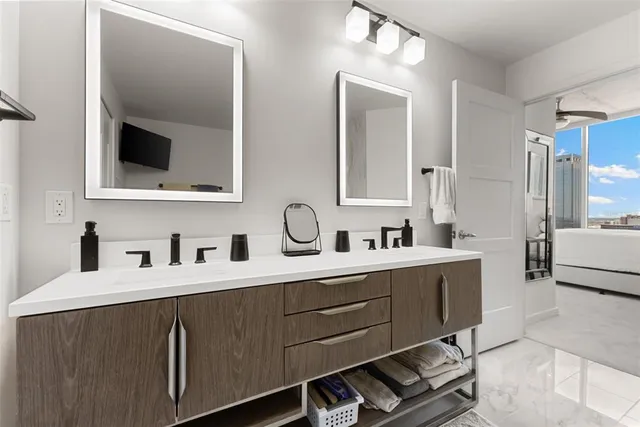 a living room with furniture and a floor to ceiling window