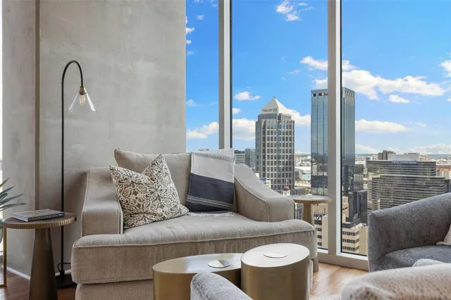 a bedroom with a bed and glass door