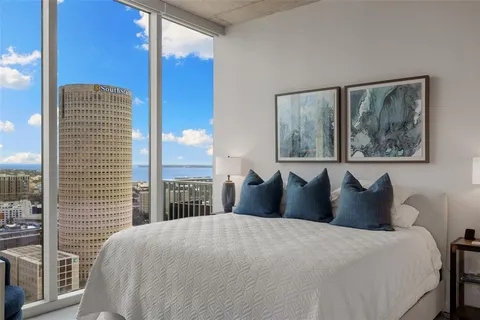 a view of balcony with a couple of chairs