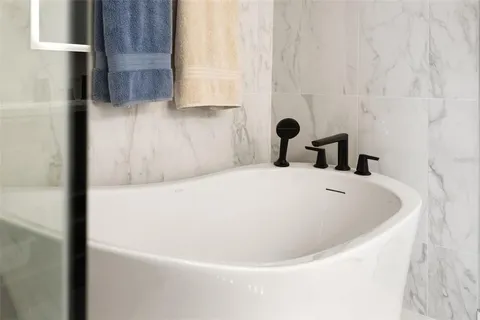 a view of swimming pool with outdoor seating and a garden