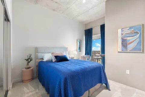 a kitchen with granite countertop a refrigerator and a sink