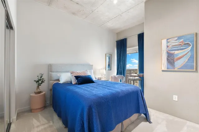 a kitchen with granite countertop a refrigerator and a sink