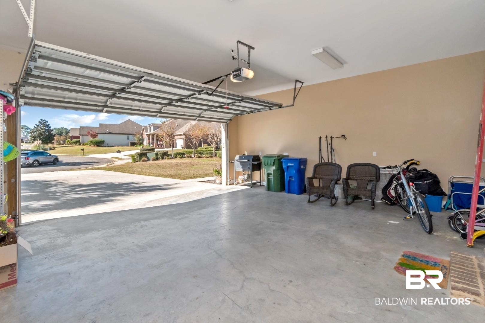 9905 Carnoustie Court Foley, AL 36535 - Photo 25 of 31 Garage with a residential view and a garage door opener