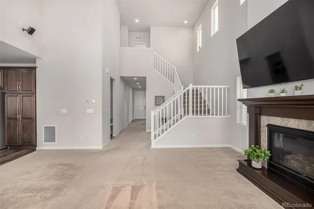 a view of livingroom with furniture fireplace and flat screen tv