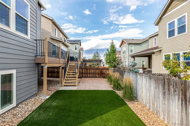 an aerial view of residential house with an outdoor space